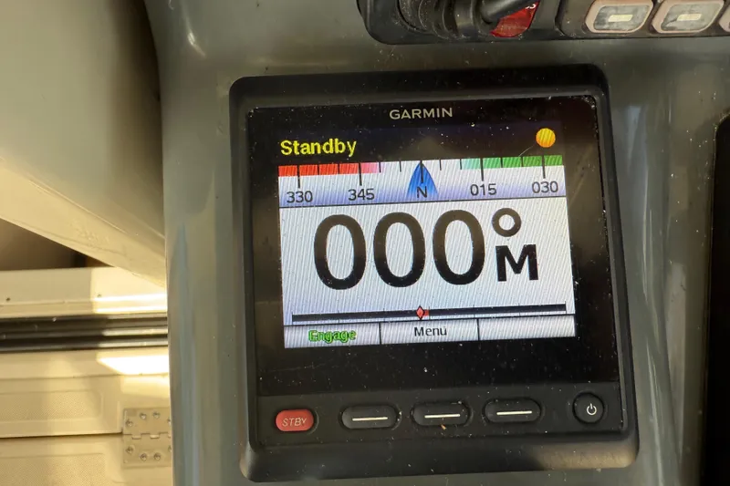 Slide: The Image of Garmin navigation display on 2004 Pursuit 3100 Offshore boat, showing standby mode. - 41