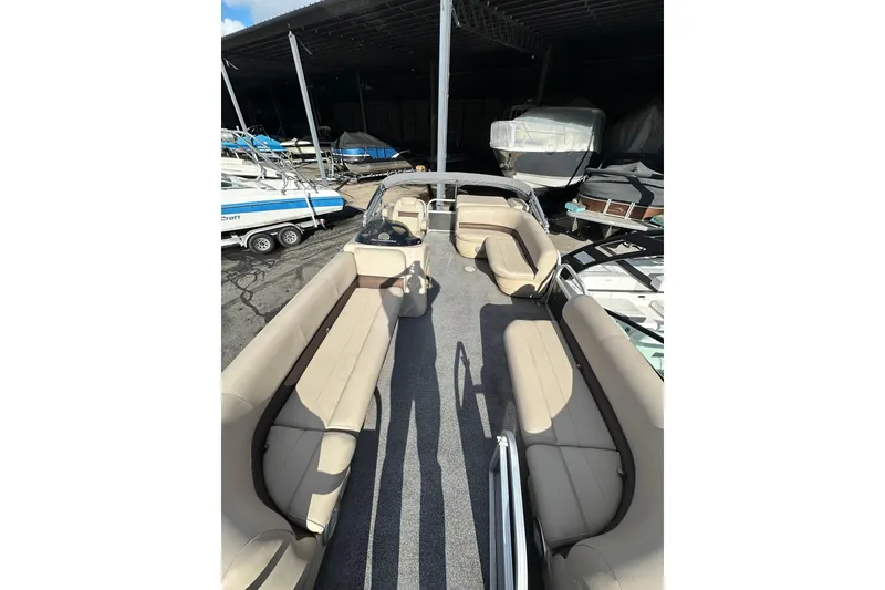 Slide: The Image of 2017 Sun Tracker Party Barge 20 DLX pontoon boat with spacious seating in storage facility. - 7
