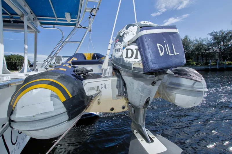 Slide: The Image of Inflatable boat with motor labeled "Dill" on a 1996 Manta 40 yacht. - 15