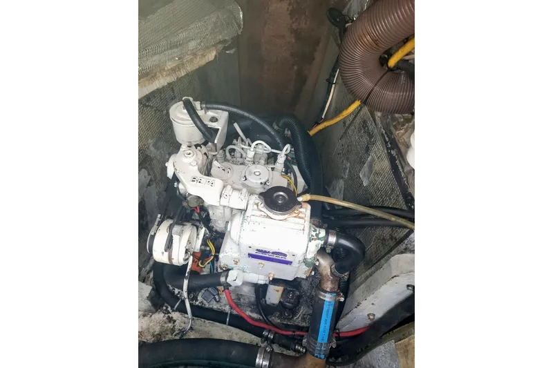 Slide: The Image of Engine compartment of a 1996 Manta 40 boat, featuring a Beta Marine engine. - 21