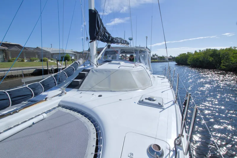 Slide: The Image of Sailing on a 1996 Manta 40 catamaran in a sunny canal setting. - 23