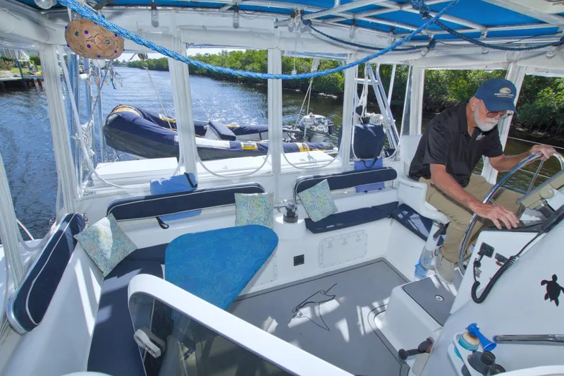 Slide: The Image of Man operating a 1996 Manta 40 sailboat, featuring a spacious cockpit and comfortable seating. - 37
