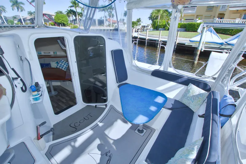 Slide: The Image of Interior of 1996 Manta 40 sailboat with seating area and waterfront view. - 40