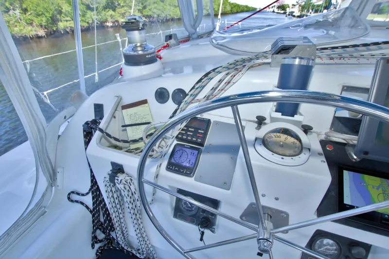 Slide: The Image of Cockpit of 1996 Manta 40 sailboat with navigation instruments and steering wheel. - 44