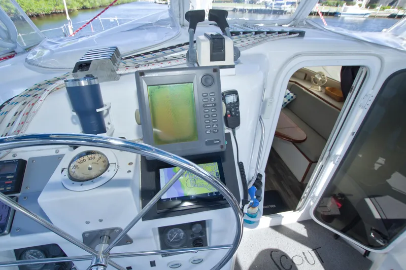 Slide: The Image of Cockpit of 1996 Manta 40 sailboat with navigation equipment and steering wheel. - 45