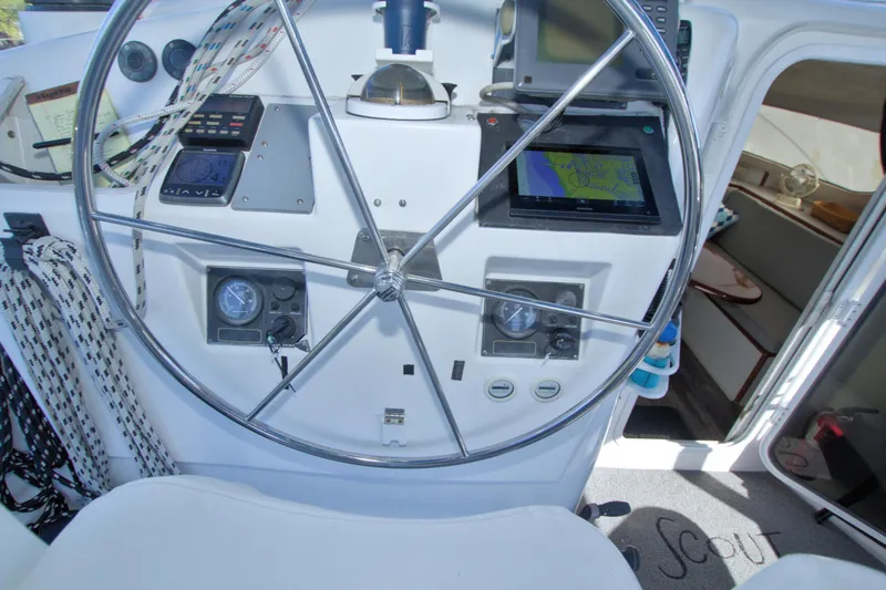 Slide: The Image of 1996 Manta 40 yacht helm with navigation equipment and steering wheel. - 46