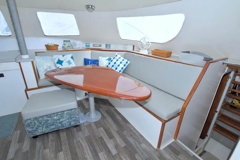 Slide: The Image of Interior of 1996 Manta 40 yacht with cozy seating and wooden table. - 47