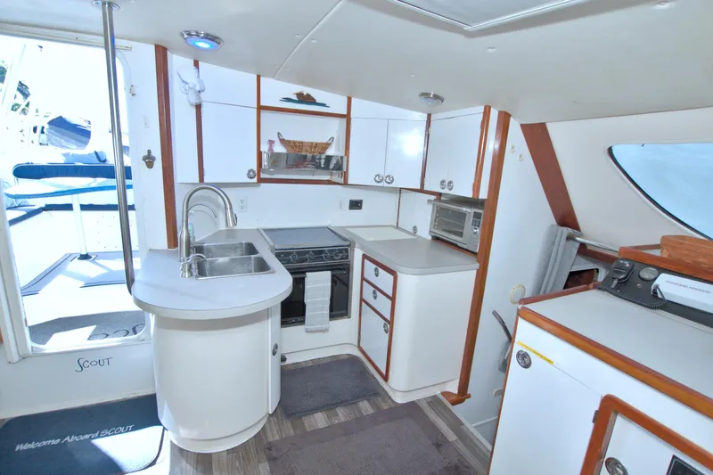 Slide: The Image of Interior of 1996 Manta 40 yacht kitchen with modern amenities and sleek design. - 52