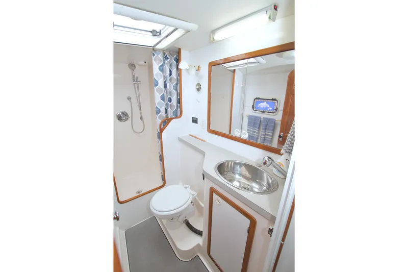 Slide: The Image of Bathroom interior of 1996 Manta 40 yacht with shower, sink, and toilet. - 59