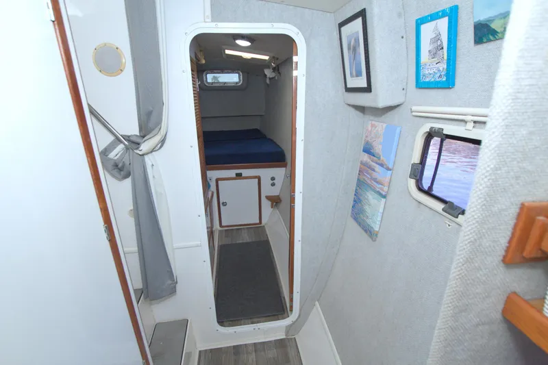 Slide: The Image of Interior of a 1996 Manta 40 sailboat cabin with cozy decor and artwork. - 63