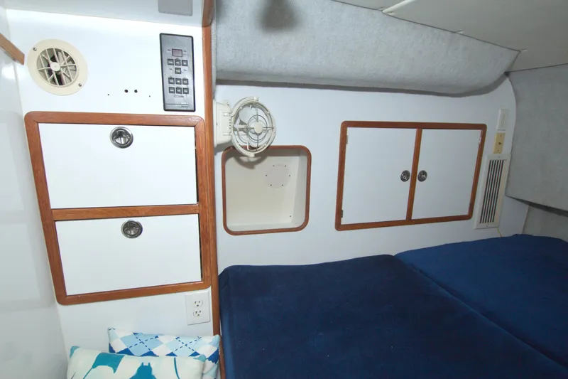 Slide: The Image of Interior cabin of a 1996 Manta 40 yacht with storage and bedding. - 66