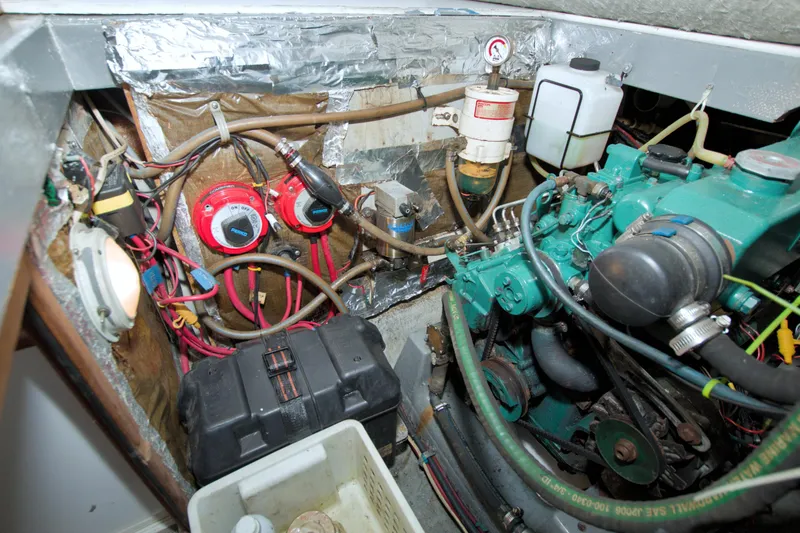 Slide: The Image of Engine compartment of a 1996 Manta 40 boat, showing wiring and mechanical components. - 70