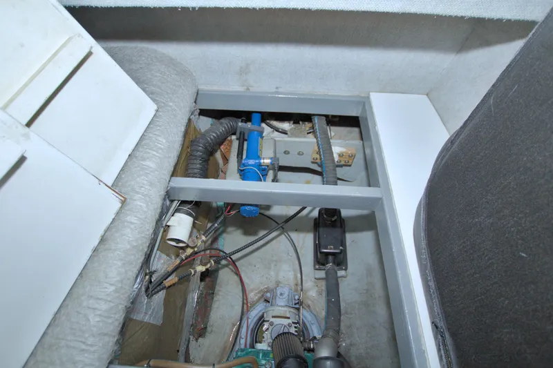 Slide: The Image of Interior view of a 1996 Manta 40 boat, showcasing mechanical components and wiring. - 77