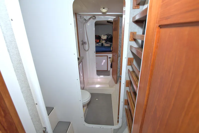 Slide: The Image of Interior of 1996 Manta 40 yacht showing bathroom and wooden cabinetry. - 82