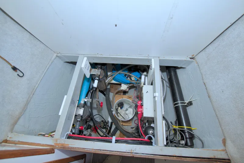 Slide: The Image of Engine compartment of a 1996 Manta 40 boat, showing various mechanical components. - 88
