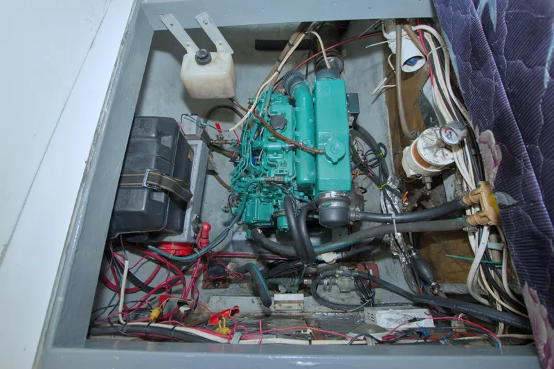 Slide: The Image of Engine compartment of a 1996 Manta 40 sailboat, featuring wiring and components. - 97