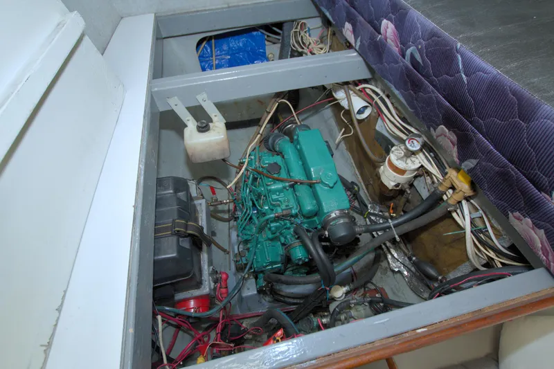 Slide: The Image of Engine compartment of a 1996 Manta 40 boat, showcasing wiring and components. - 98