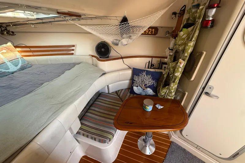 Slide: The Image of Cozy cabin interior of 2005 Grady-White Express 330 with comfortable bedding and nautical decor. - 18