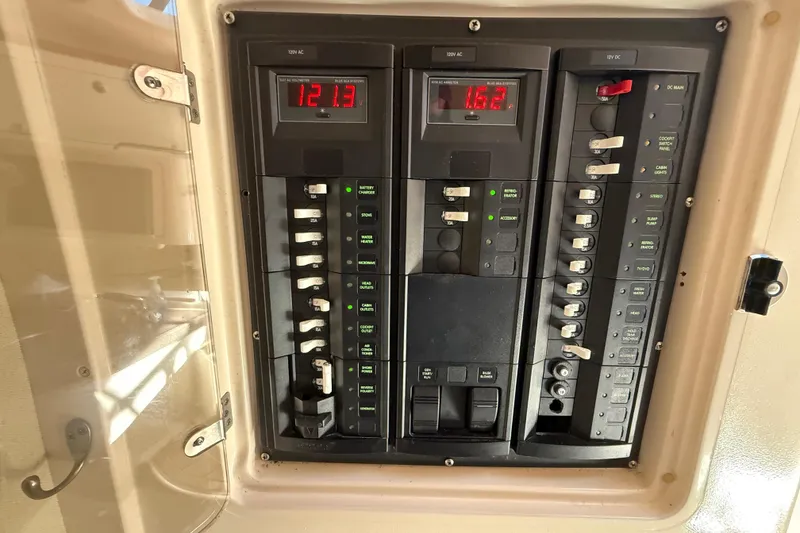 Slide: The Image of Interior of 2005 Grady-White Express 330 boat with kitchenette and seating area. - 26