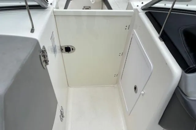 Slide: The Image of Yamaha outboard motor on 2015 Chaparral 250 Suncoast boat, docked outdoors. - 11