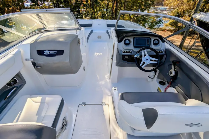 Slide: The Image of 2015 Chaparral 250 Suncoast boat interior with steering wheel and seating. - 26