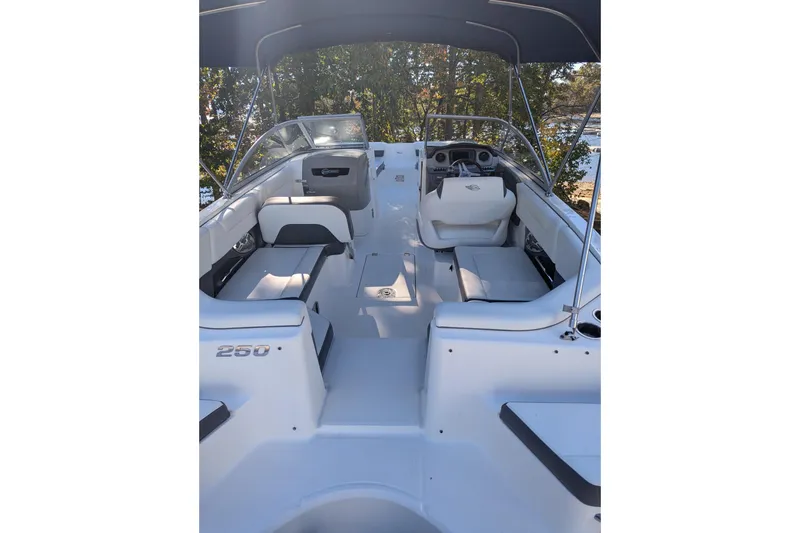 Slide: The Image of 2015 Chaparral 250 Suncoast boat interior with seating and steering console. - 30