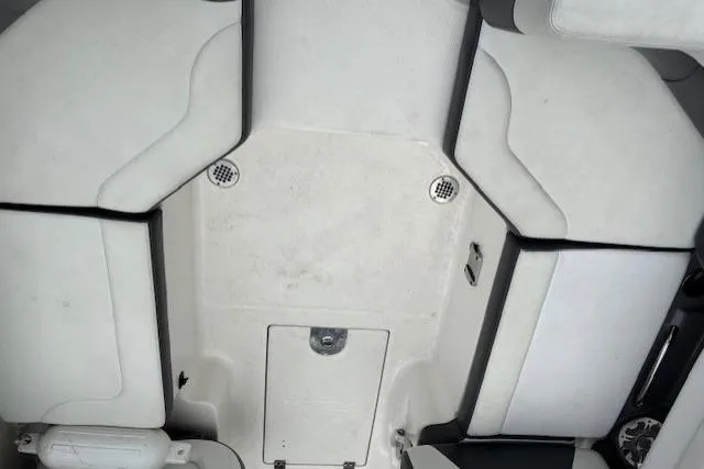 Slide: The Image of 2015 Chaparral 250 Suncoast boat with Yamaha outboard motor, docked outdoors. - 7