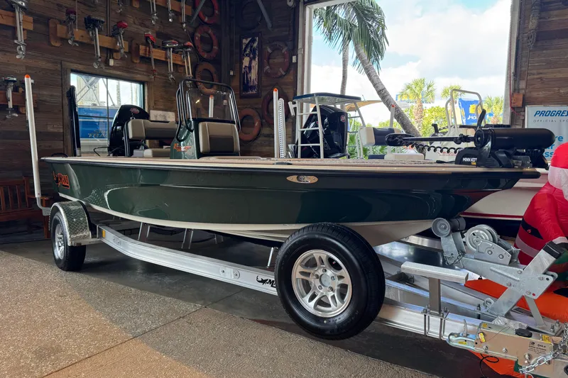 The Image of 2026 Mako 18 Pro Skiff Backwater Edition boat displayed in a showroom. - 0