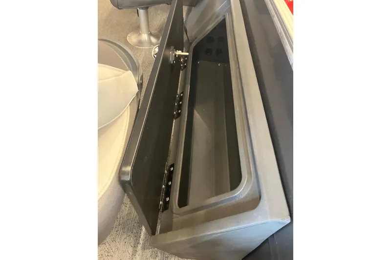 Slide: The Image of Storage compartment on 2026 Sun Tracker Fishin' Barge 22 DLX boat interior. - 6