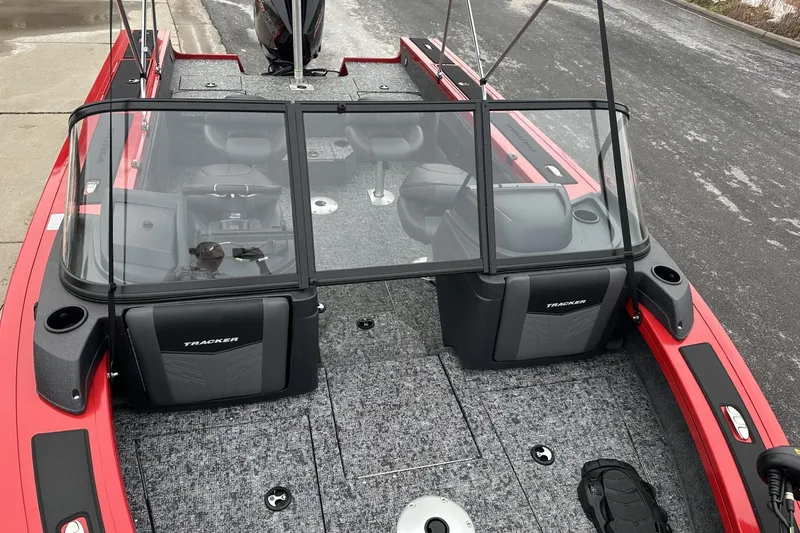 Slide: The Image of 2026 Tracker Targa V-19 Combo boat with red exterior and spacious interior layout. - 11
