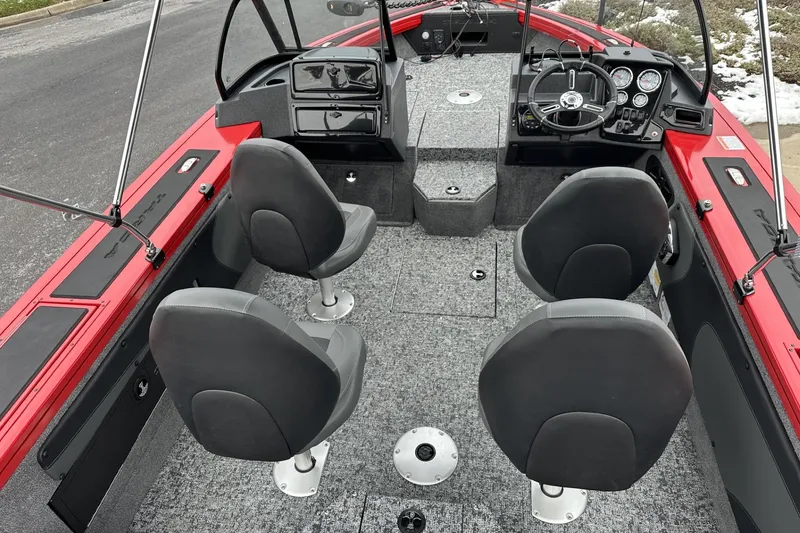 Slide: The Image of 2026 Tracker Targa V-19 Combo boat storage compartment with gear inside. - 15