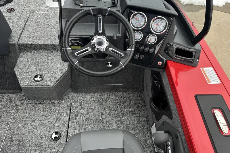 Slide: The Image of 2026 Tracker Targa V-19 Combo boat interior with seating and storage compartments. - 17