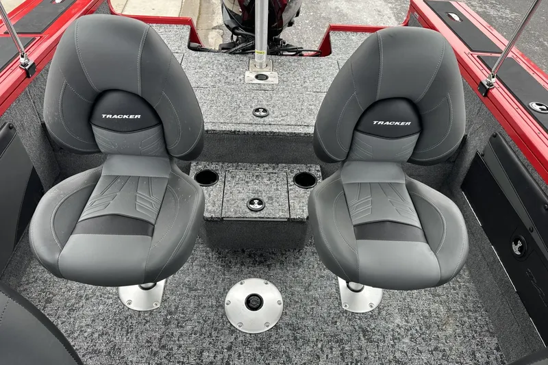 Slide: The Image of 2026 Tracker Targa V-19 Combo boat interior with two gray seats and carpeted flooring. - 19