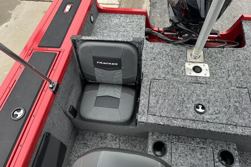 Slide: The Image of 2026 Tracker Targa V-19 Combo boat interior with steering console and seating. - 21