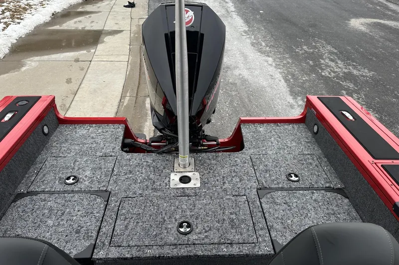 Slide: The Image of 2026 Tracker Targa V-19 Combo boat with carpeted deck and outboard motor. - 22