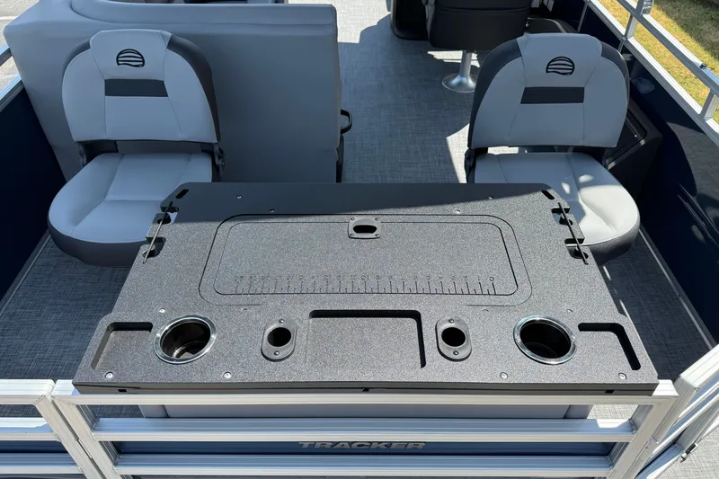 Slide: The Image of 2026 Sun Tracker SportFish 22 DLX interior with seating and fishing station. - 13