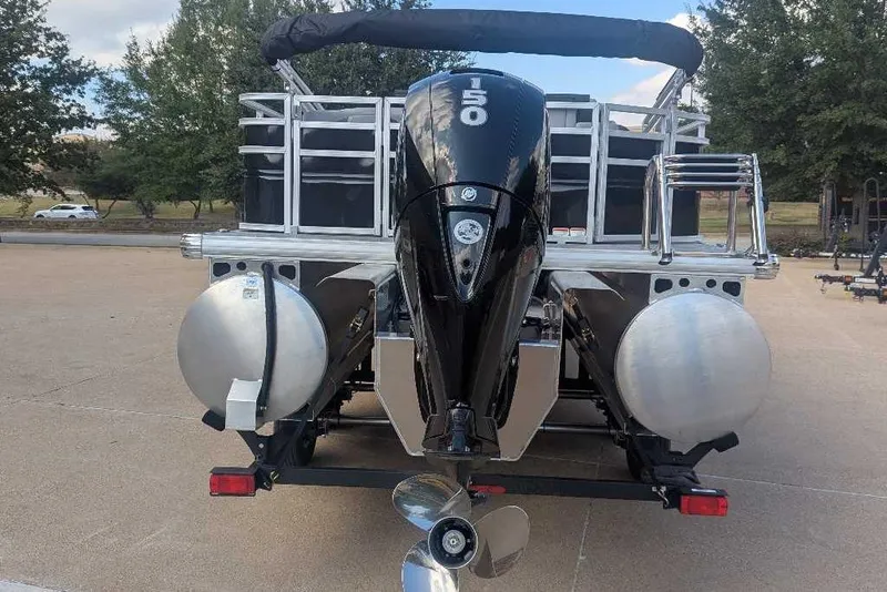 Slide: The Image of 2026 Sun Tracker SportFish 22 XP3 pontoon boat with powerful outboard motor. - 3