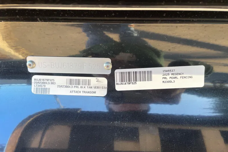 Slide: The Image of 2025 Regency 230 DL3 boat identification tags with serial numbers and model details. - 87