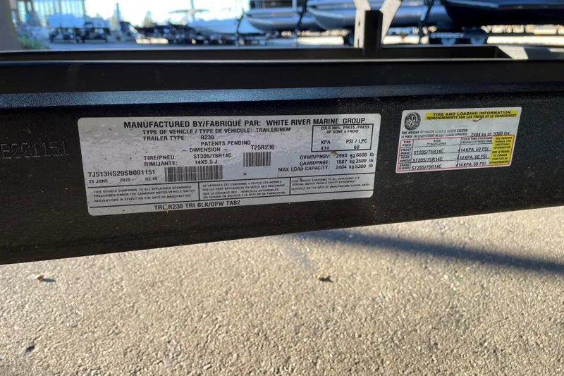 Slide: The Image of Label on a 2025 Regency 230 DL3 trailer, detailing specifications and tire information. - 89