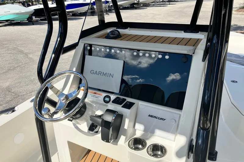 Slide: The Image of 2026 Ranger 2360 Bay boat console with Garmin and Mercury controls. - 6