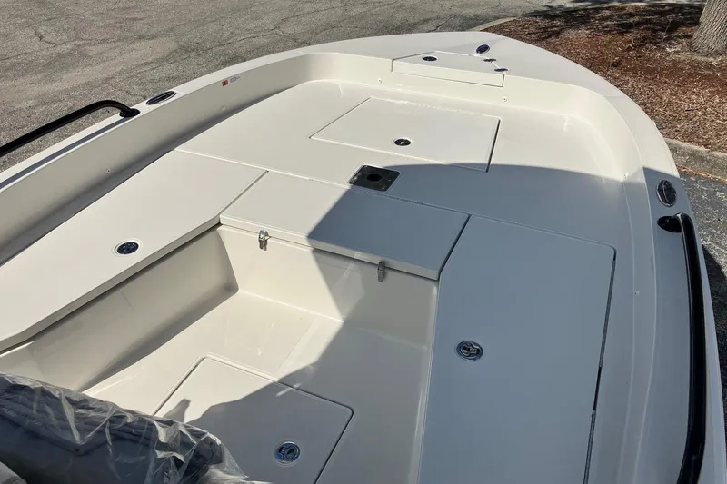 Slide: The Image of 2026 Ranger 2360 Bay boat deck with storage compartments and clean design. - 9
