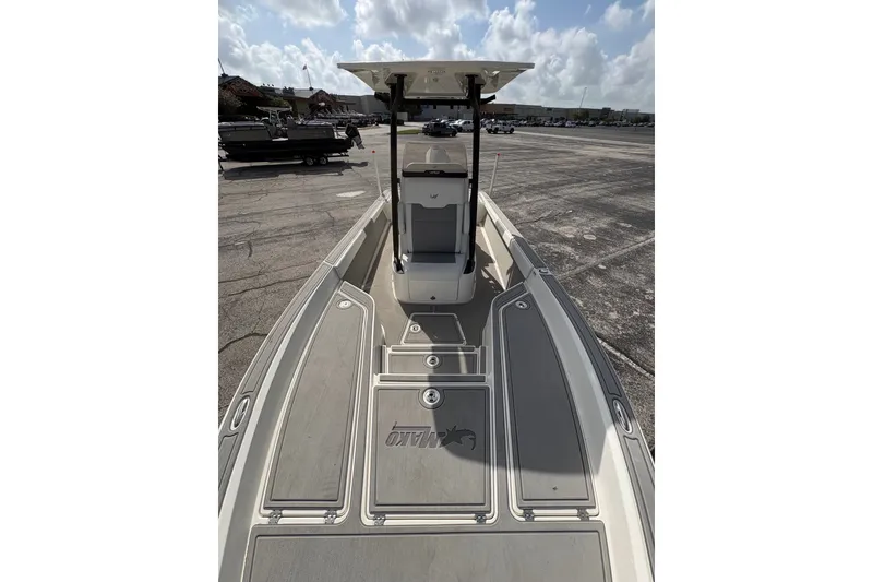 Slide: The Image of 2026 Mako 24 APEX boat with spacious deck and modern design. - 10