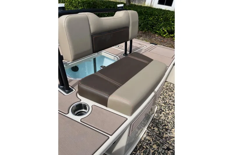Slide: The Image of 2026 Mako 18 Pro Skiff Backwater Edition boat seat with cup holder and storage. - 10