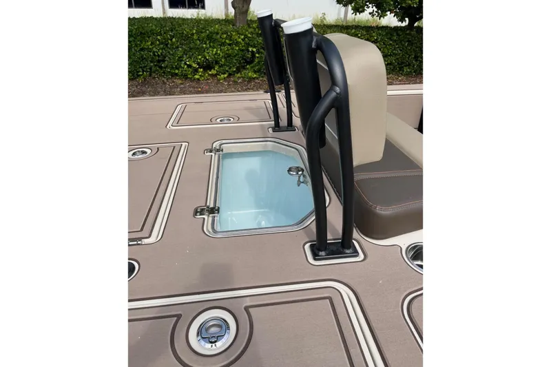 Slide: The Image of 2026 Mako 18 Pro Skiff Backwater Edition deck with storage compartments and seating. - 11
