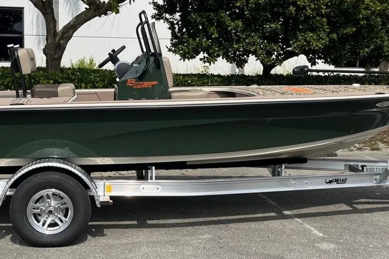 Slide: The Image of 2026 Mako 18 Pro Skiff Backwater Edition on trailer, parked outdoors. - 16