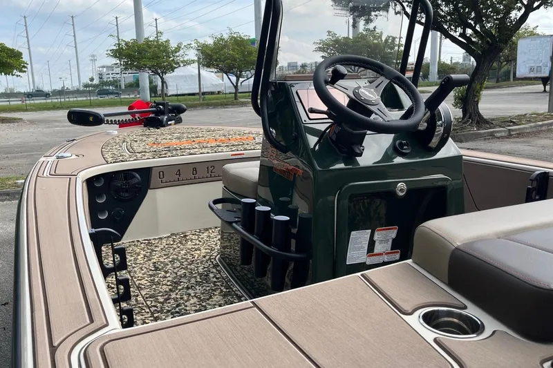 Slide: The Image of 2026 Mako 18 Pro Skiff Backwater Edition boat interior with steering console and seating. - 9