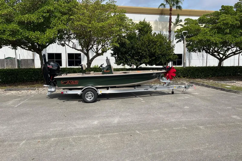 Slide: The Image of 2026 Mako 18 Pro Skiff Backwater Edition on trailer, parked outdoors. - 91
