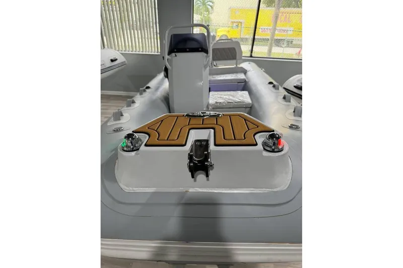 Slide: The Image of 2026 East Marine 360 boat interior with modern controls and seating. - 7