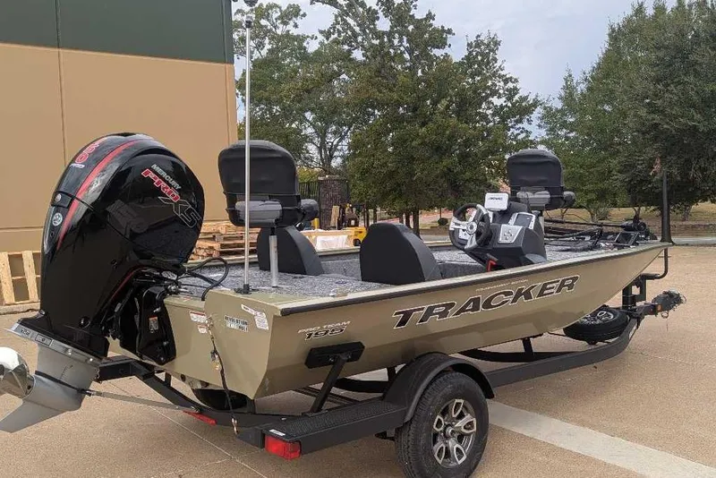 Slide: The Image of 2026 Tracker Pro Team 195 boat on trailer, featuring powerful outboard motor. - 5
