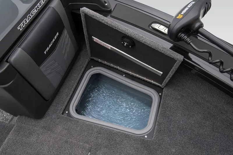 Slide: The Image of 2026 Tracker Targa V-18 WT boat battery compartment with Interstate battery visible. - 20
